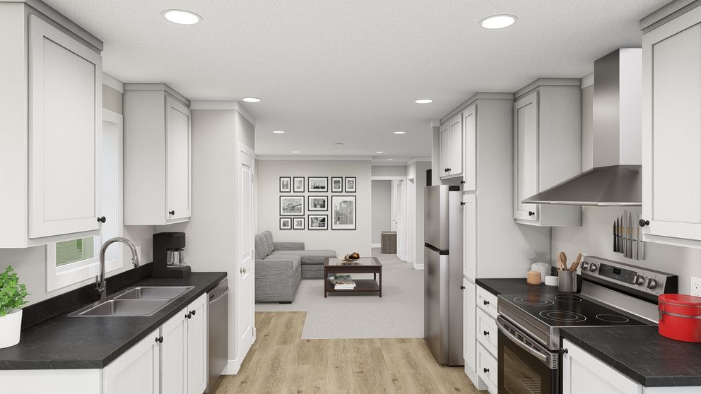 The HERE COMES THE SUN Kitchen. This Manufactured Mobile Home features 3 bedrooms and 2 baths.