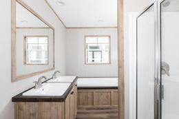 The REVOLUTION 76A Primary Bathroom. This Manufactured Mobile Home features 3 bedrooms and 2 baths.