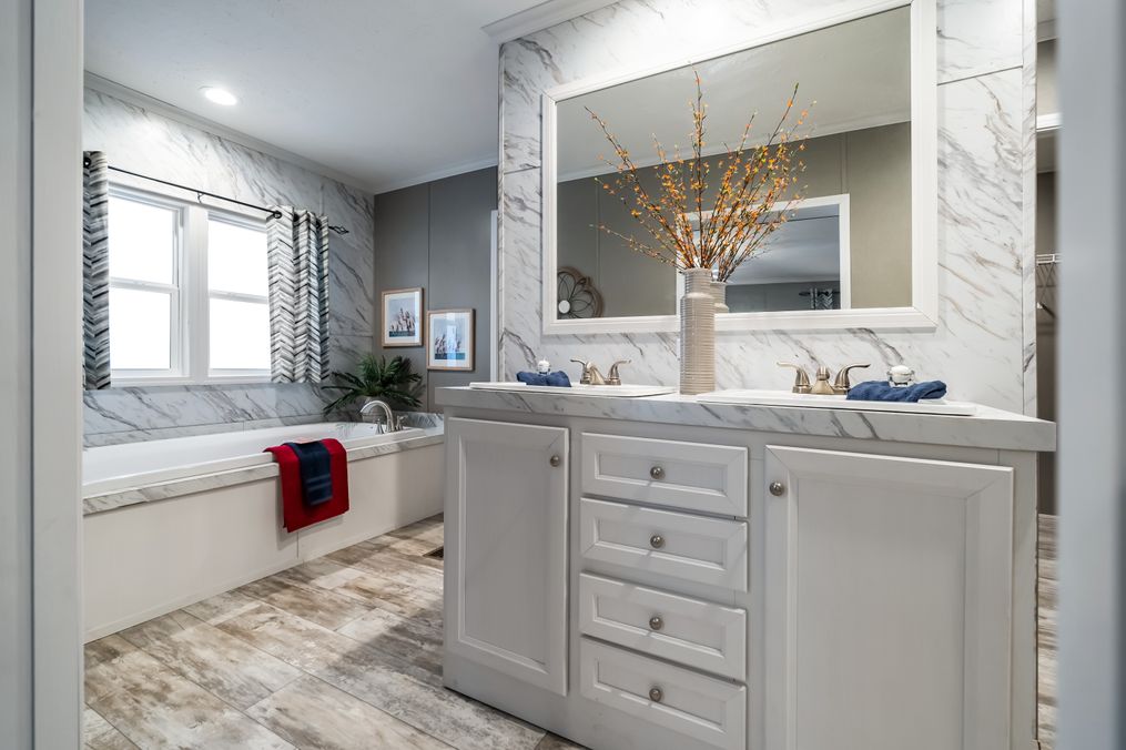 The CASCADE Primary Bathroom. This Manufactured Mobile Home features 4 bedrooms and 2 baths.