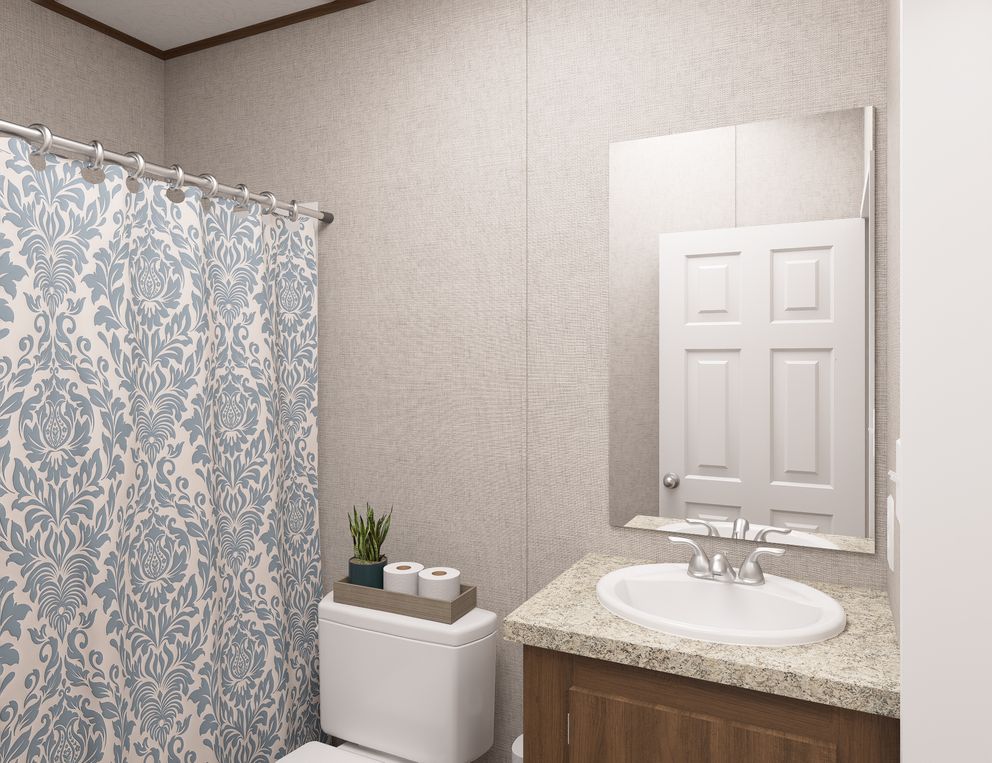The ASPEN Guest Bathroom. This Manufactured Mobile Home features 3 bedrooms and 2 baths.