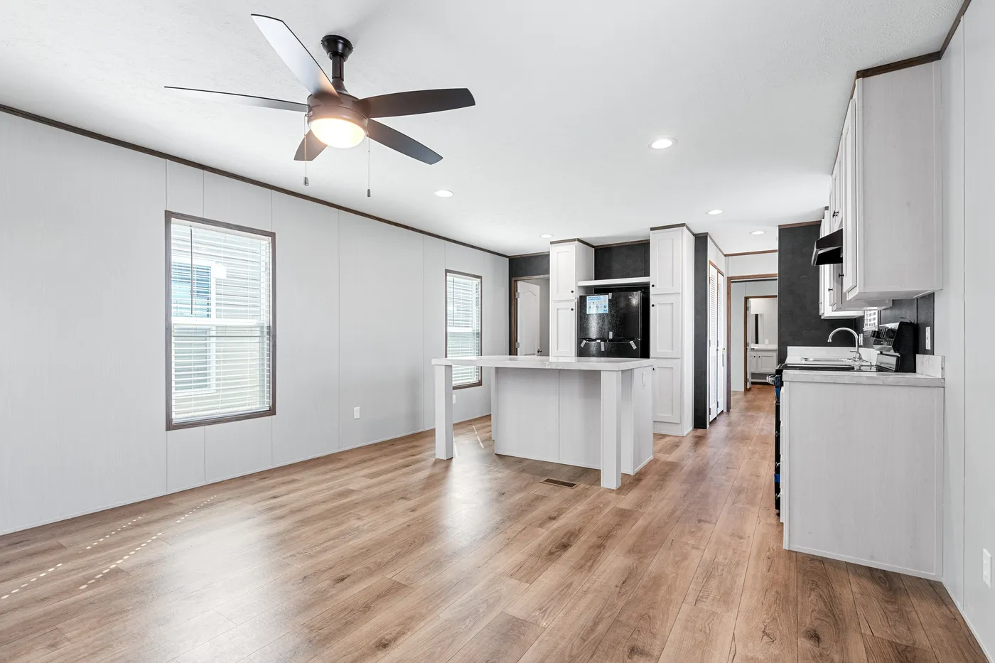 The HOMESTEAD 16602A Kitchen. This Manufactured Mobile Home features 2 bedrooms and 2 baths.