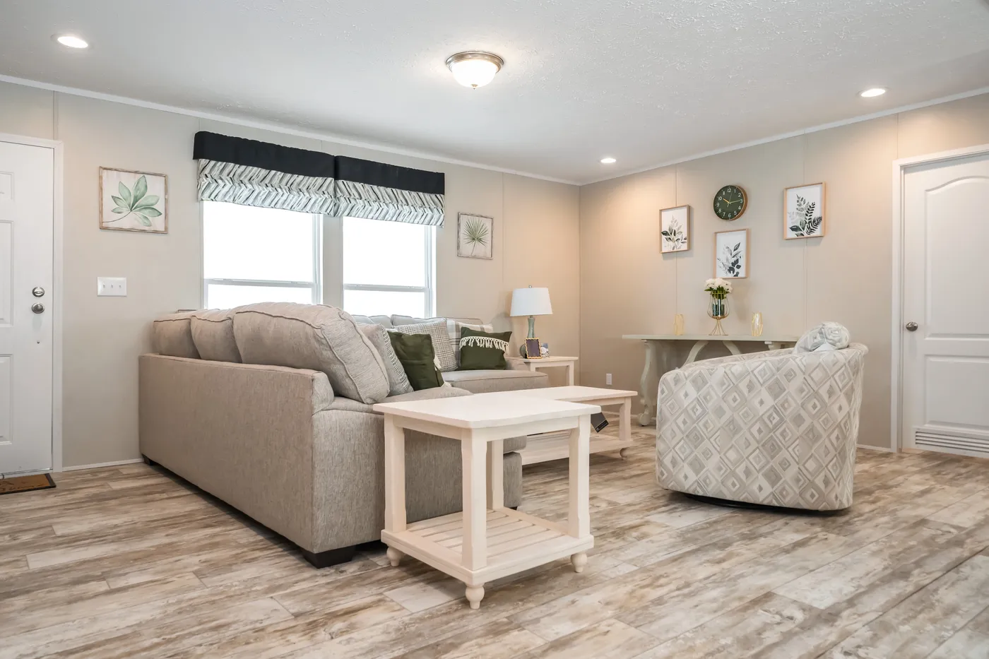 The BENJAMIN Living Room. This Manufactured Mobile Home features 3 bedrooms and 2 baths.