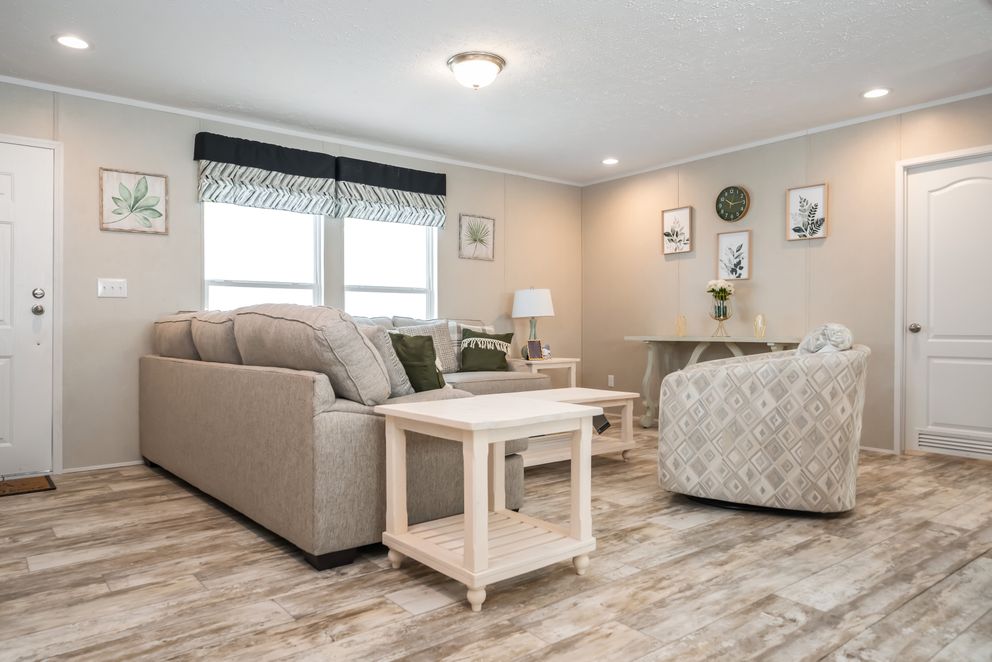 The BENJAMIN Living Room. This Manufactured Mobile Home features 3 bedrooms and 2 baths.