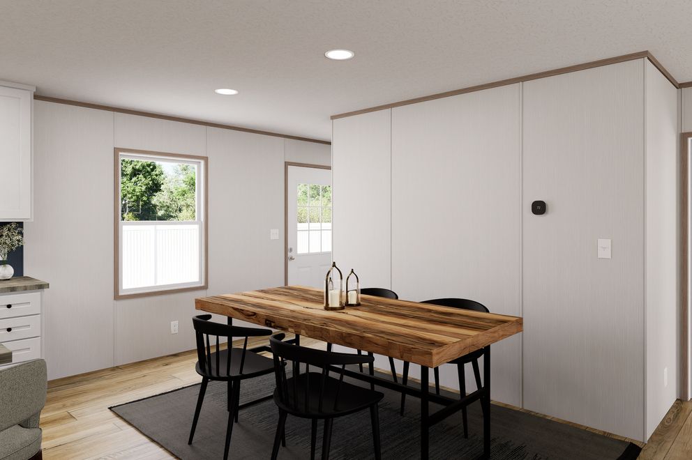 The ULTRA FLEX Dining Area. This Manufactured Mobile Home features 3 bedrooms and 2 baths.
