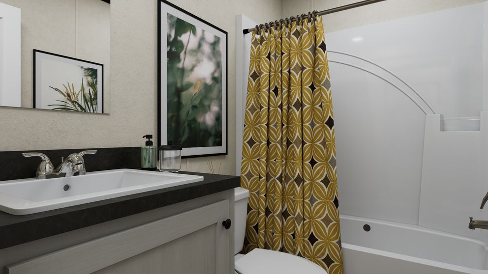 The 7616-CC03 HARBORVIEW 76 Guest Bathroom. This Manufactured Mobile Home features 3 bedrooms and 2 baths.