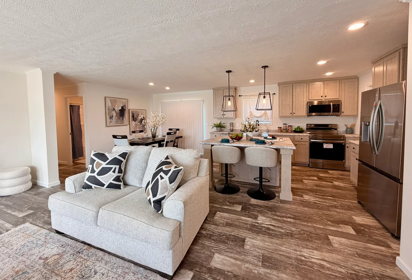 The TOURMALINE 7628-649 Living Room. This Manufactured Mobile Home features 4 bedrooms and 2 baths.