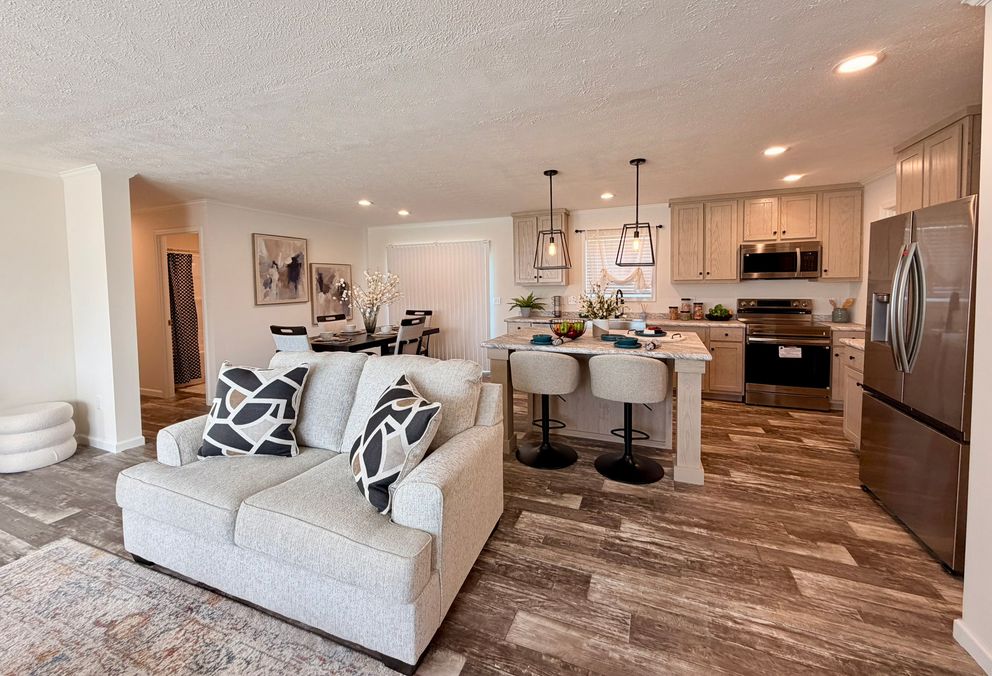 The TOURMALINE 7628-649 Living Room. This Manufactured Mobile Home features 4 bedrooms and 2 baths.