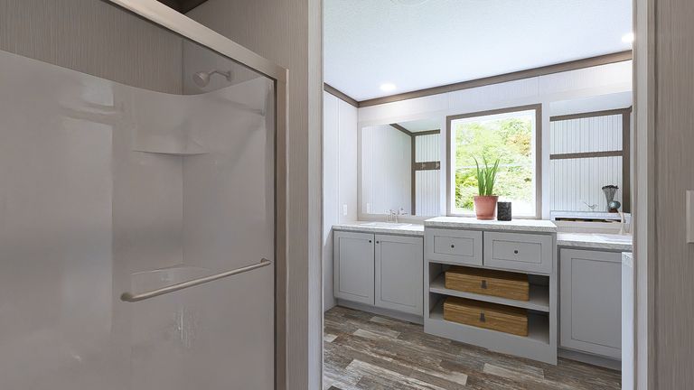 The ULTRA ISLAND BREEZE 56' Primary Bathroom. This Manufactured Mobile Home features 3 bedrooms and 2 baths.