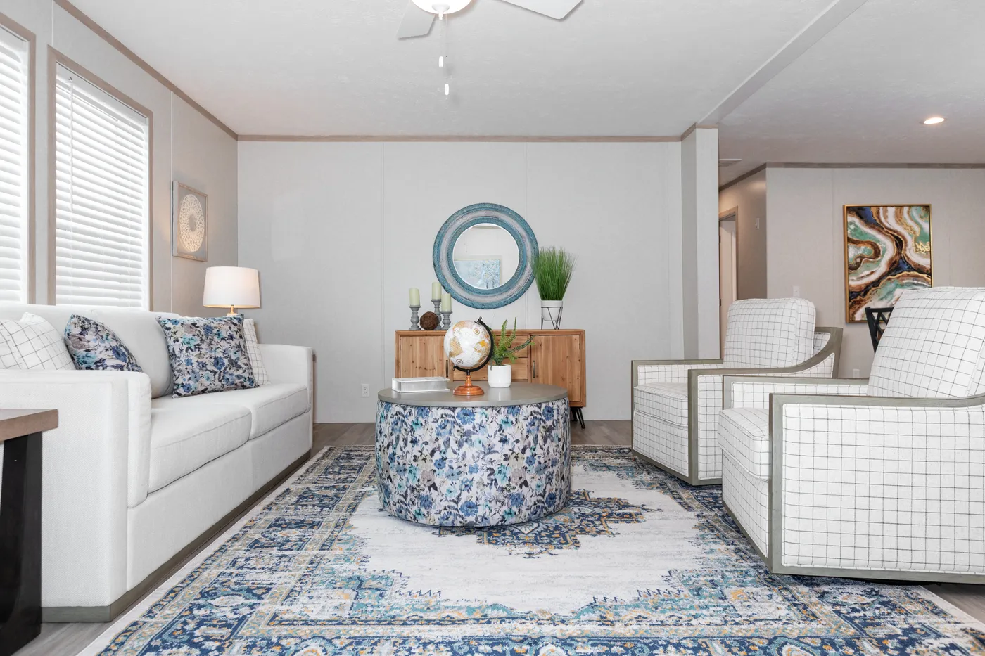 The 5628-5202 ADRENALINE Living Room. This Manufactured Mobile Home features 3 bedrooms and 2 baths.