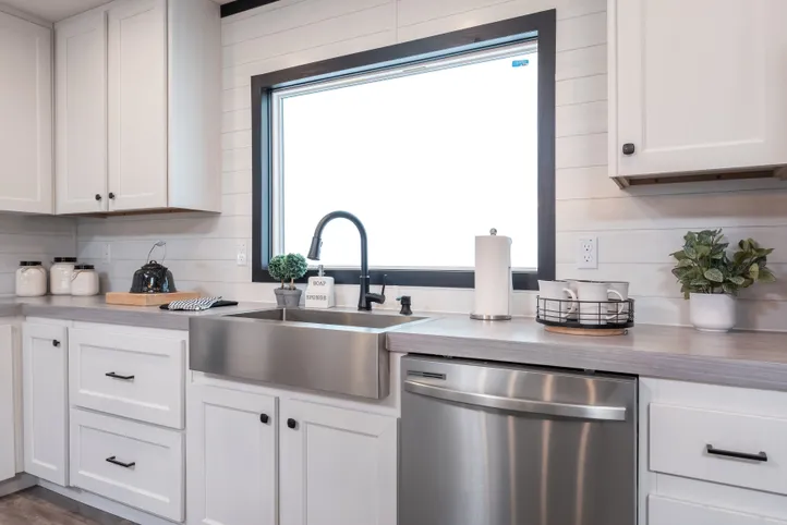 The BREEZE FARMHOUSE Kitchen. This Manufactured Mobile Home features 3 bedrooms and 2 baths.
