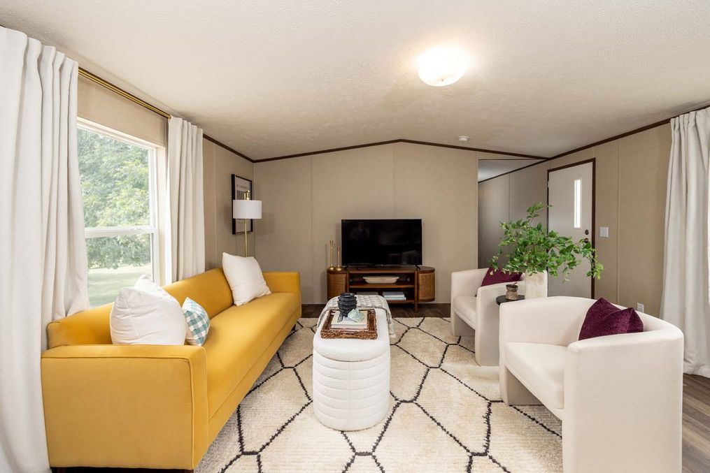 The CELEBRATION Living Room. This Manufactured Mobile Home features 3 bedrooms and 2 baths.