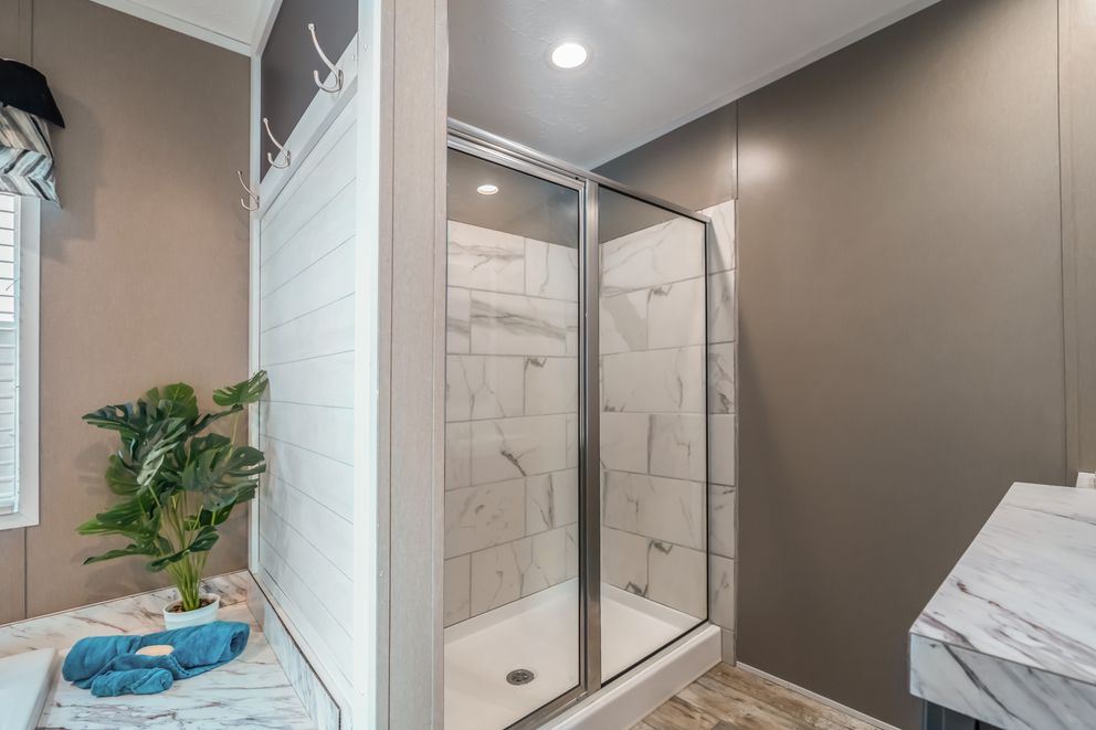 The MAJOR Primary Bathroom. This Manufactured Mobile Home features 3 bedrooms and 2 baths.