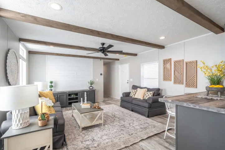 The ANNIVERSARY CHOICE Living Room. This Manufactured Mobile Home features 3 bedrooms and 2 baths.