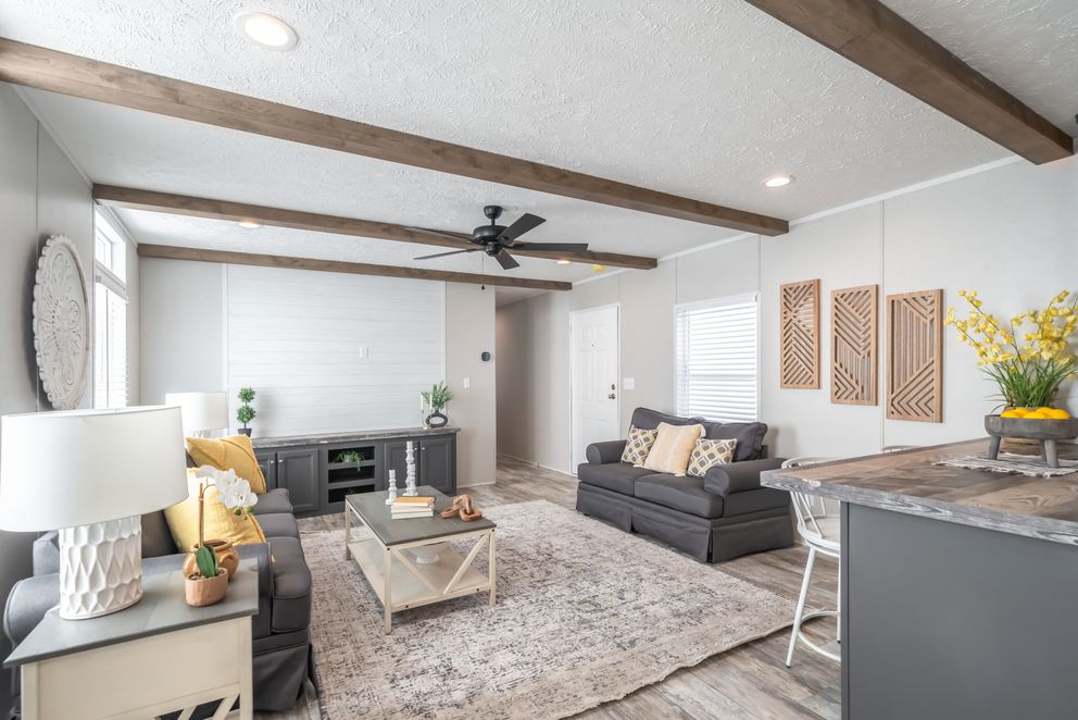 The ANNIVERSARY CHOICE Living Room. This Manufactured Mobile Home features 3 bedrooms and 2 baths.