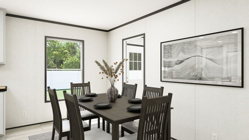 The THE MOUNTAINEER 56 Dining Area. This Manufactured Mobile Home features 3 bedrooms and 2 baths.