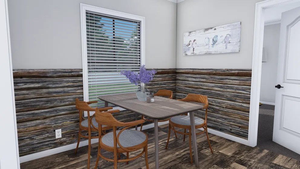 The THE HOLLYWOOD Dining Room. This Manufactured Mobile Home features 3 bedrooms and 2 baths.