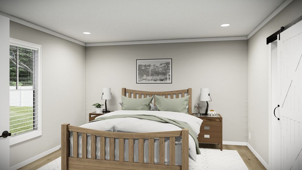 The THE WASHINGTON Primary Bedroom. This Manufactured Mobile Home features 3 bedrooms and 2 baths.
