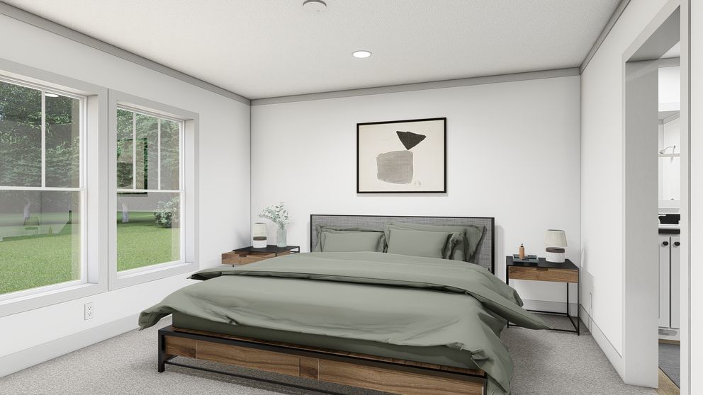 The WONDERFUL WORLD Primary Bedroom. This Manufactured Mobile Home features 3 bedrooms and 2 baths.