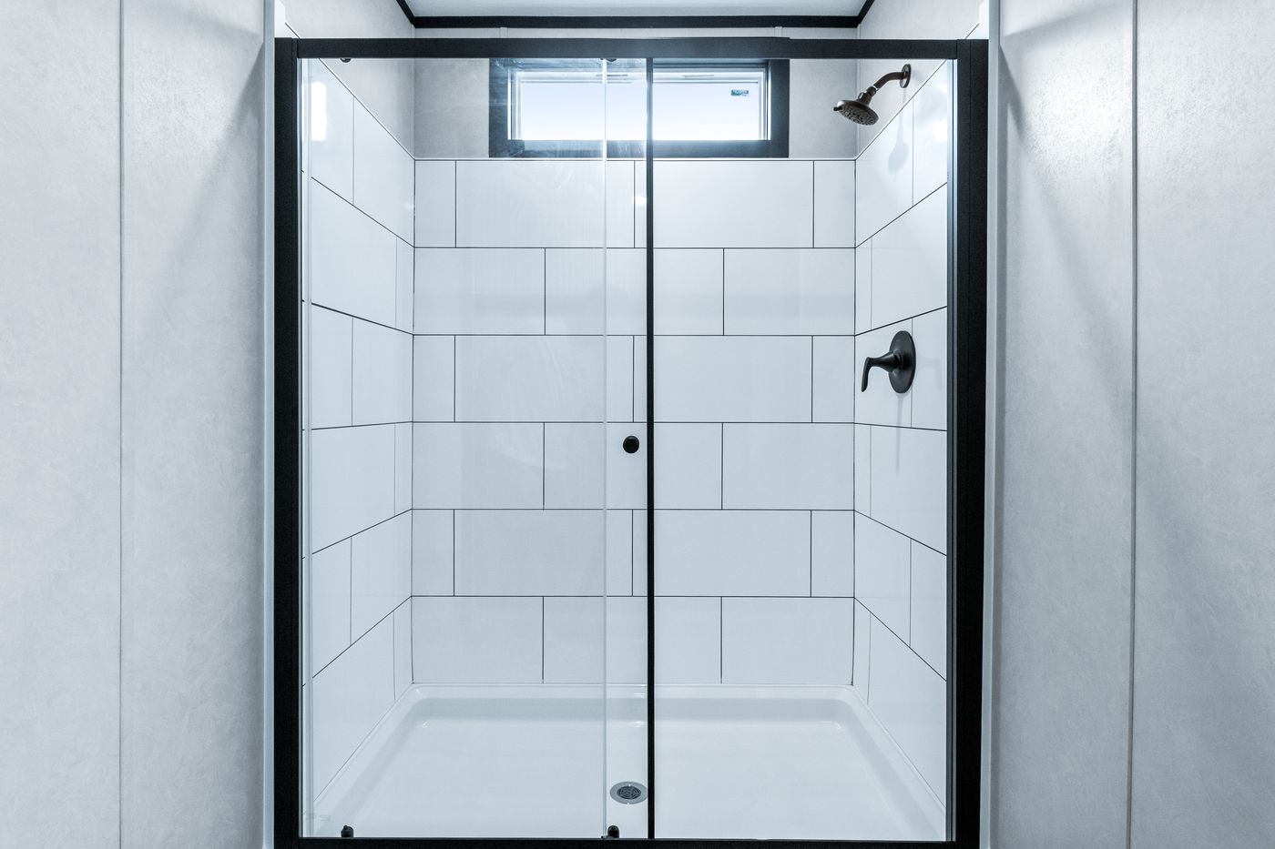The ODYSSEY Primary Bathroom. This Manufactured Mobile Home features 4 bedrooms and 2 baths.