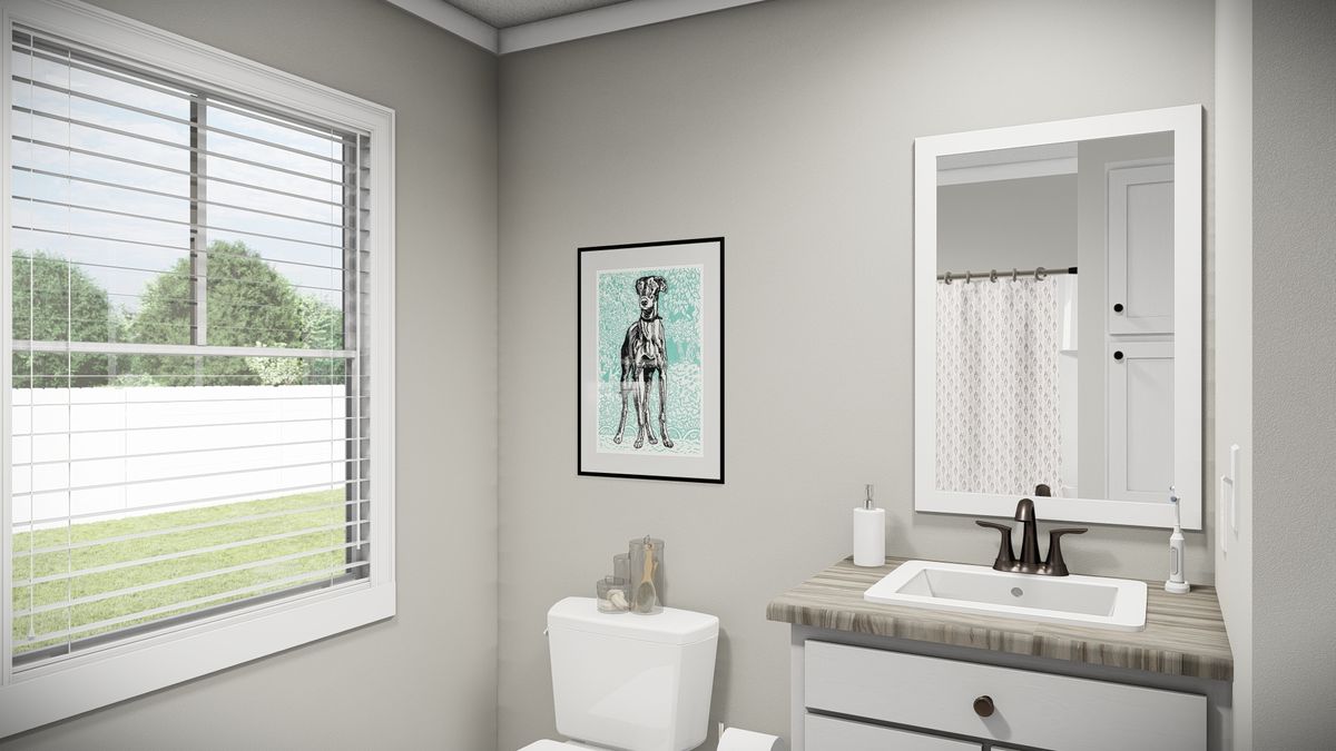 The THE REVERE Guest Bathroom. This Manufactured Mobile Home features 4 bedrooms and 2 baths.