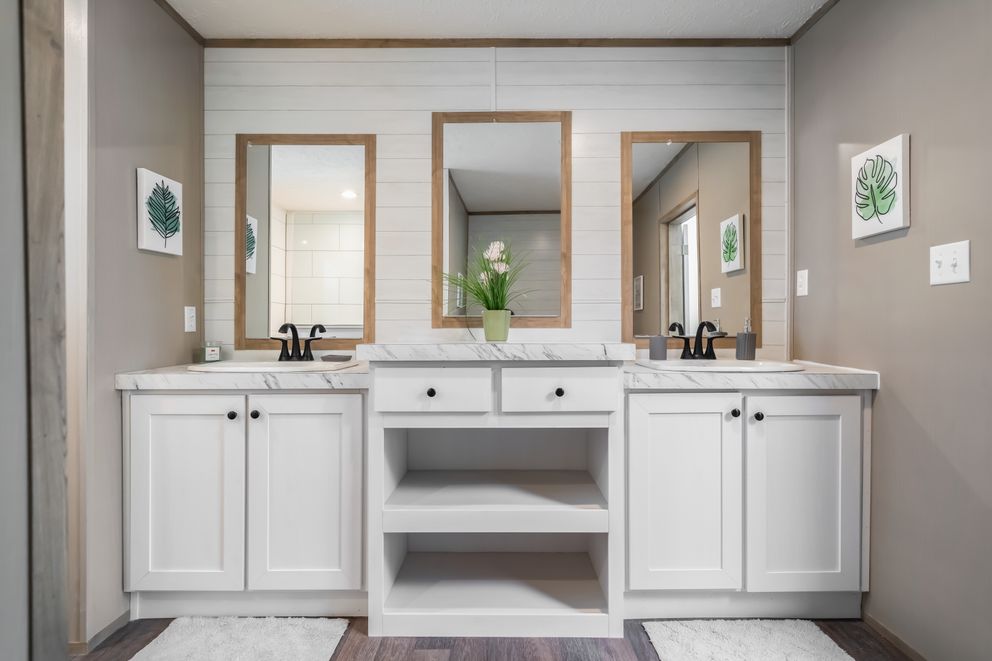 The FARMHOUSE BREEZE 72 Primary Bathroom. This Manufactured Mobile Home features 4 bedrooms and 2 baths.