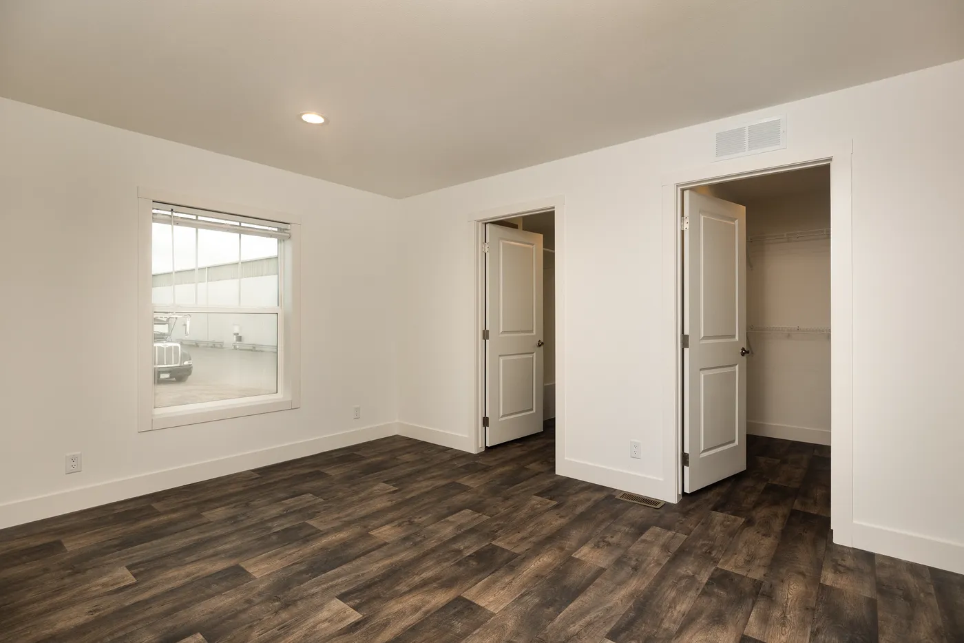 The RAMSEY 223 Primary Bedroom. This Manufactured Mobile Home features 3 bedrooms and 2 baths.