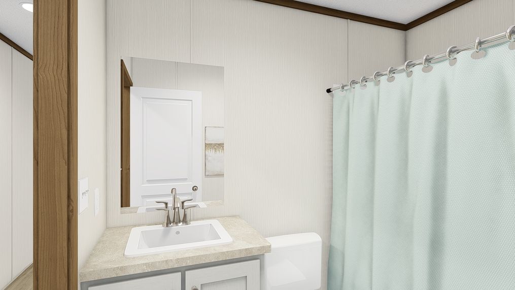 The DYNAMIC Guest Bathroom. This Manufactured Mobile Home features 3 bedrooms and 2 baths.