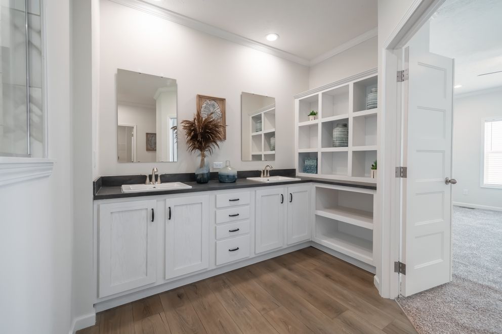 The 1533 THE BROOK HUD Primary Bathroom. This Manufactured Mobile Home features 3 bedrooms and 2 baths.
