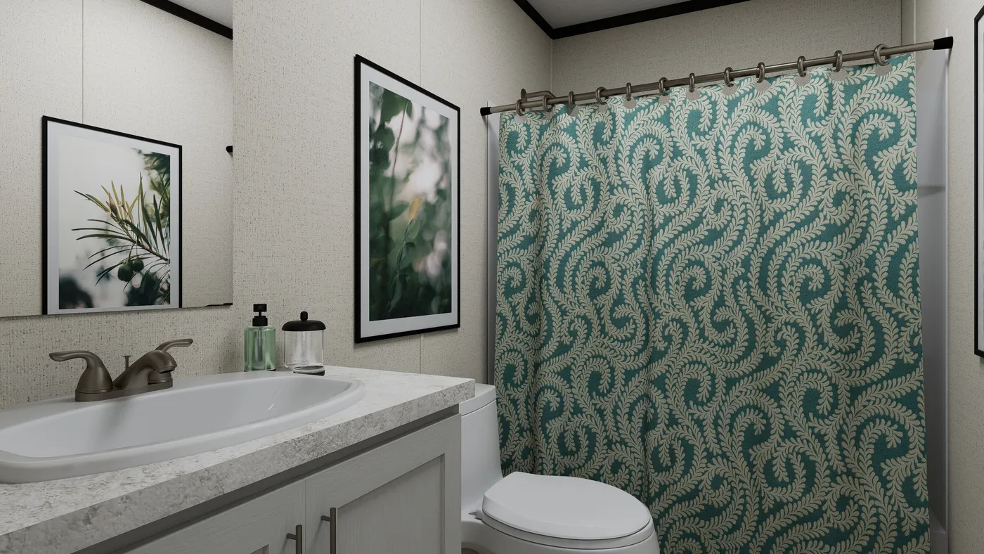 The THE MOUNTAINEER 52 Guest Bathroom. This Manufactured Mobile Home features 3 bedrooms and 2 baths.