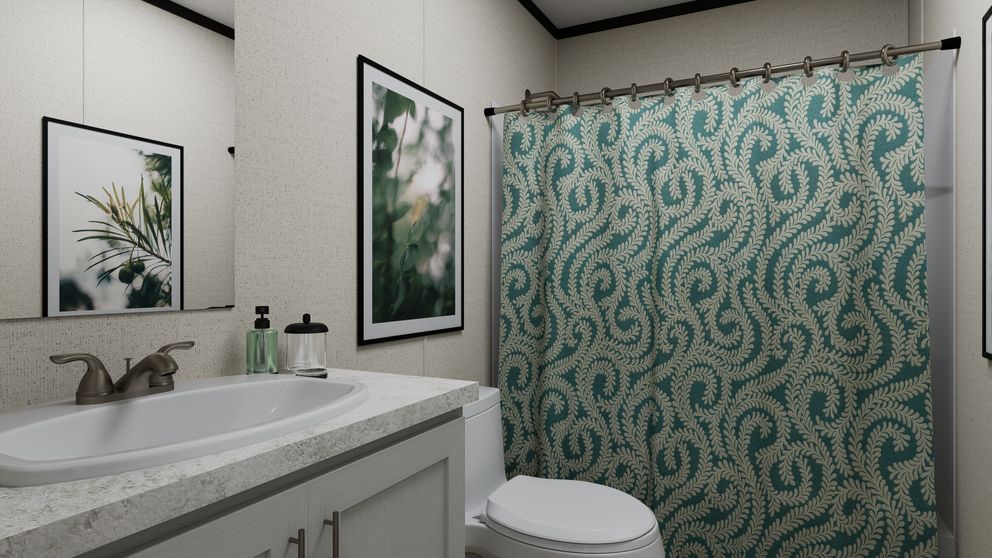 The THE MOUNTAINEER 52 Guest Bathroom. This Manufactured Mobile Home features 3 bedrooms and 2 baths.