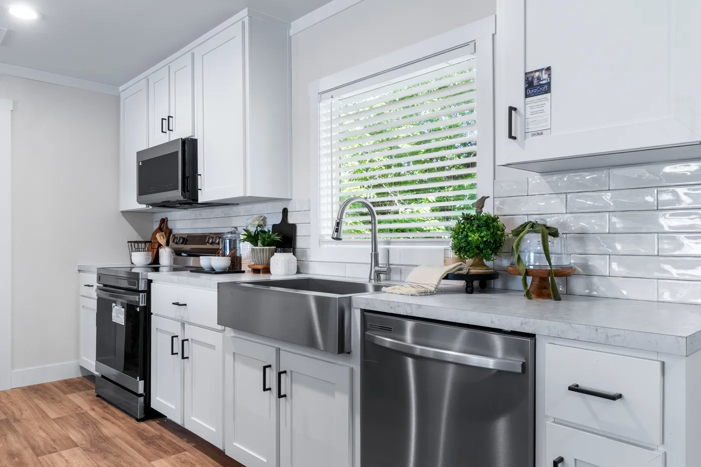 The FARM 4 FLEX ELITE Kitchen. This Manufactured Mobile Home features 4 bedrooms and 3 baths.