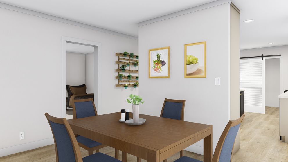The LET IT BE Dining Area. This Manufactured Mobile Home features 3 bedrooms and 2 baths.