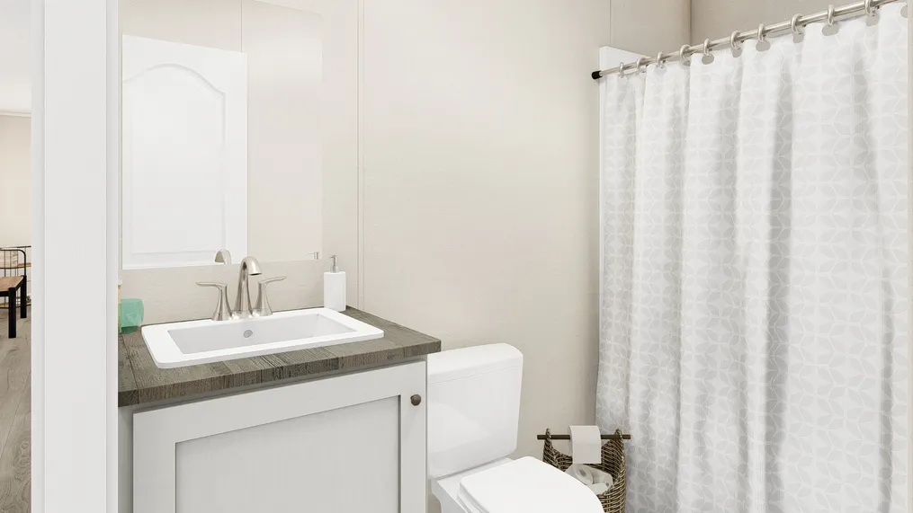 The THE ANNIVERSARY PLUS Guest Bathroom. This Manufactured Mobile Home features 3 bedrooms and 2 baths.