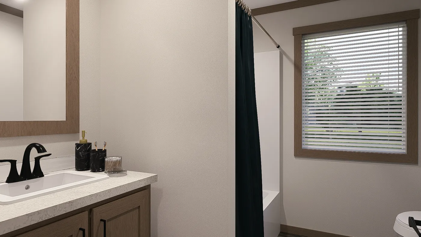 The TINSLEY Guest Bathroom. This Manufactured Mobile Home features 4 bedrooms and 2 baths.