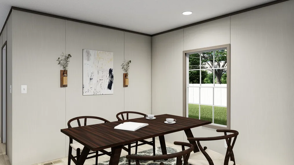 The ULTRA BREEZE 28X76 Dining Area. This Manufactured Mobile Home features 4 bedrooms and 2 baths.