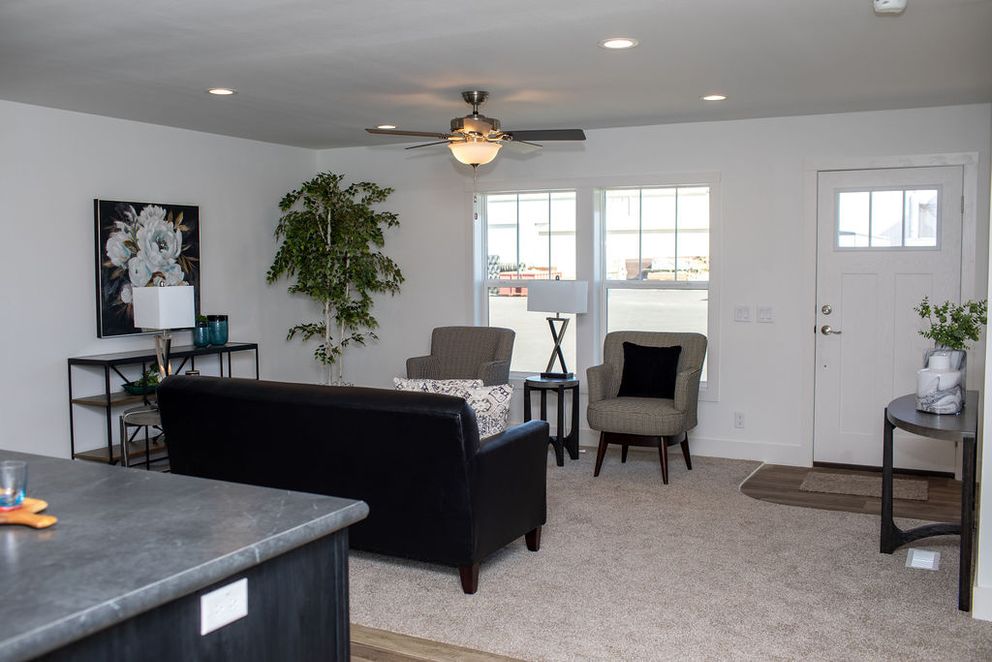 The BROWN EYED GIRL Living Room. This Manufactured Mobile Home features 4 bedrooms and 2 baths.