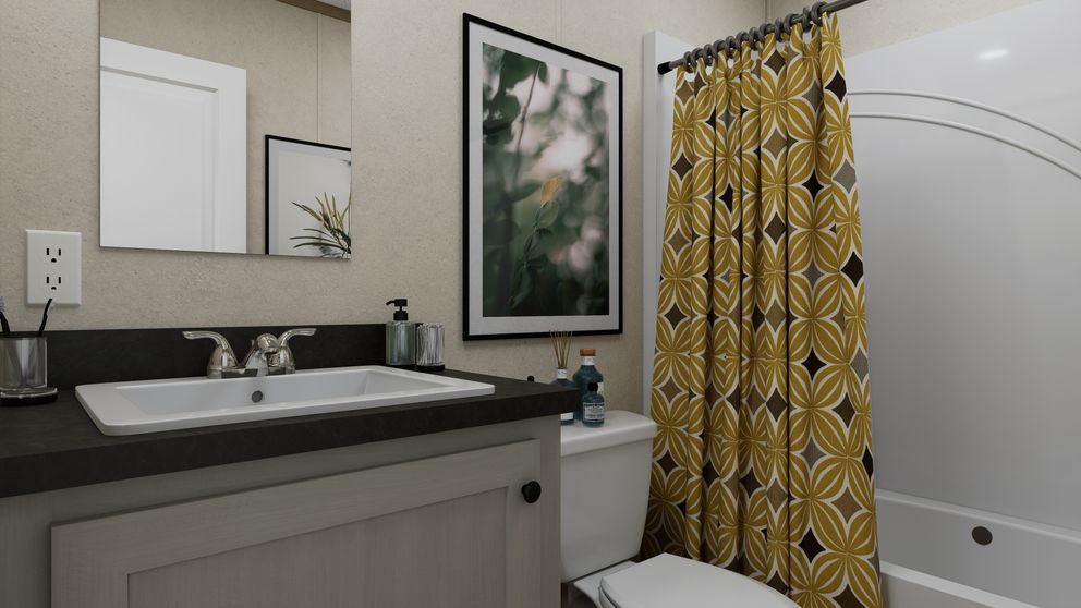 The 5624-CC56 GUARDIAN 56 Guest Bathroom. This Manufactured Mobile Home features 3 bedrooms and 2 baths.