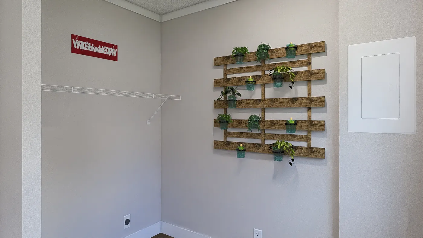 The STILL THE ONE Utility Room. This Manufactured Mobile Home features 2 bedrooms and 2 baths.