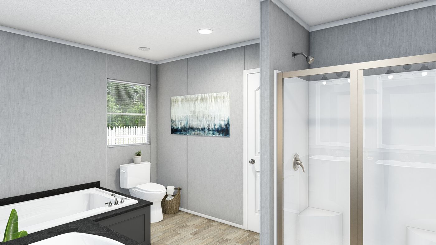 The TRADITION 60B Primary Bathroom. This Manufactured Mobile Home features 3 bedrooms and 2 baths.