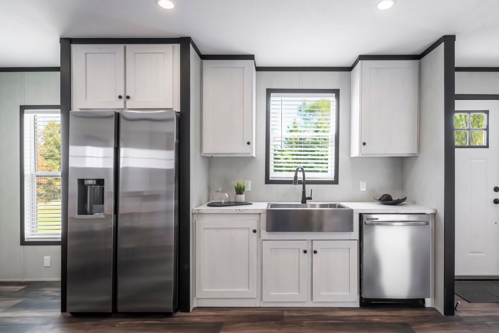 The LIL SOUTHERN CHARM Kitchen. This Manufactured Mobile Home features 3 bedrooms and 2 baths.