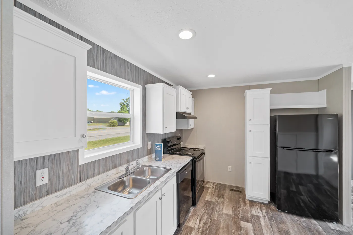 The ZIRCON Kitchen. This Manufactured Mobile Home features 3 bedrooms and 2 baths.