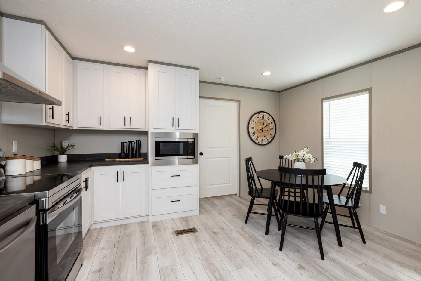 The SHOWER HOUSE Kitchen. This Manufactured Mobile Home features 3 bedrooms and 2 baths.