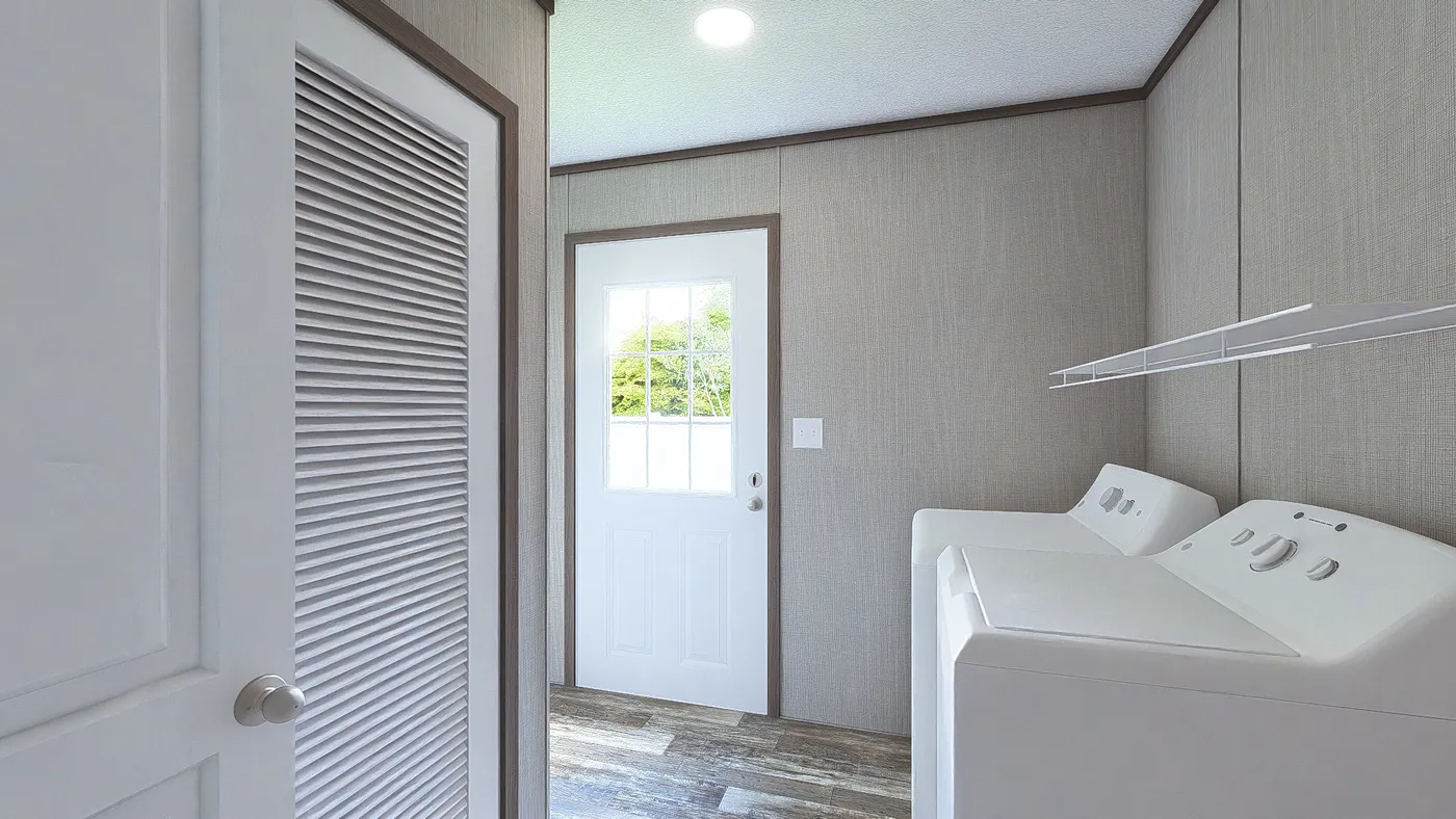 The ULTRA BREEZE 28X52 Utility Room. This Manufactured Mobile Home features 3 bedrooms and 2 baths.