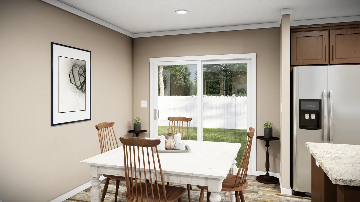 The THE LLOYD II Dining Area. This Manufactured Mobile Home features 3 bedrooms and 2 baths.