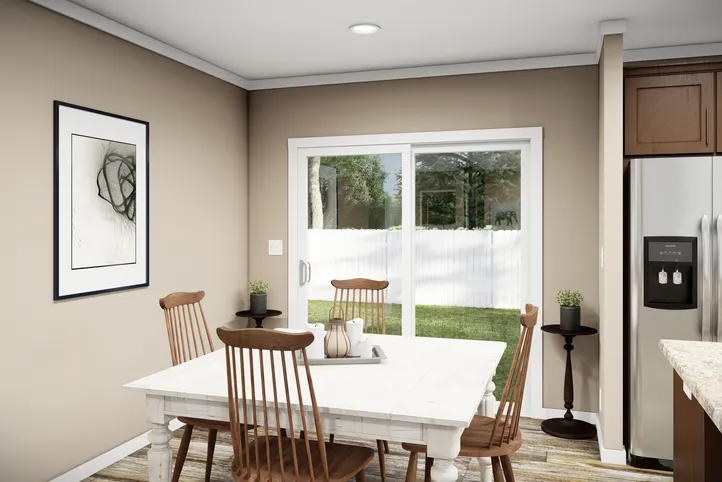 The THE LLOYD II Dining Area. This Manufactured Mobile Home features 3 bedrooms and 2 baths.