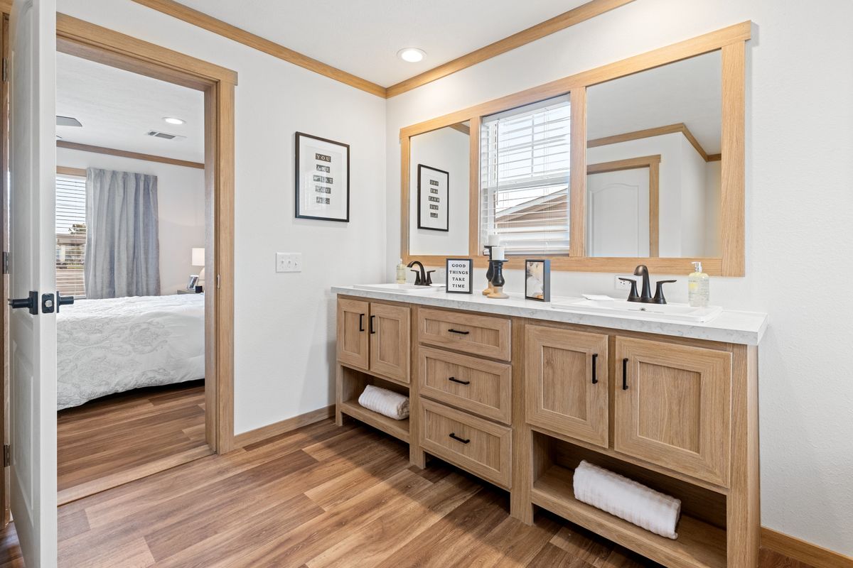 The THATCHER Primary Bathroom. This Manufactured Mobile Home features 4 bedrooms and 2 baths.