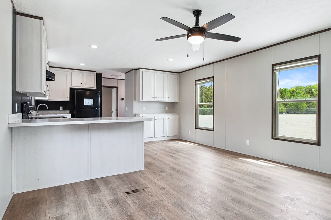 The HOMESTEAD 16562A Kitchen. This Manufactured Mobile Home features 2 bedrooms and 2 baths.