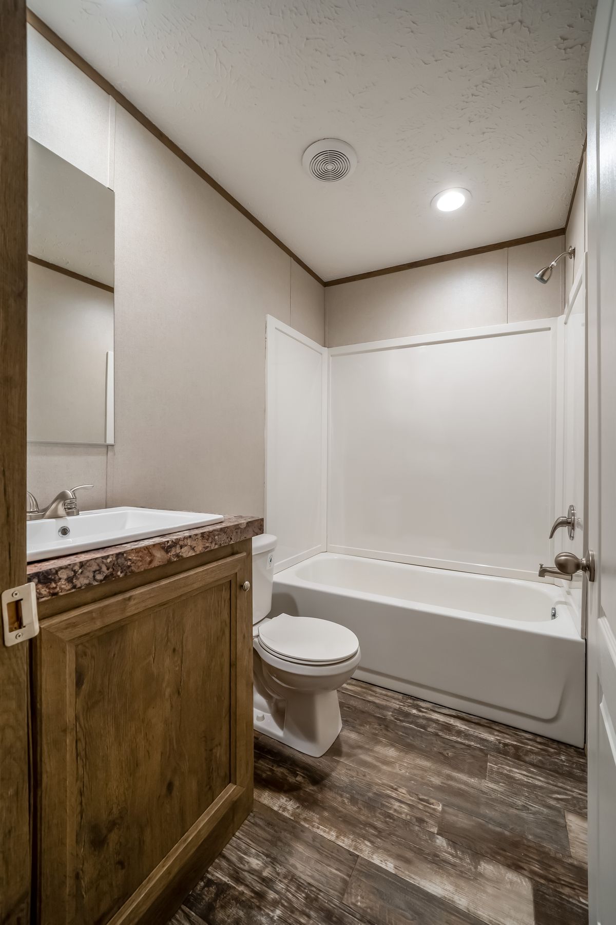 The ANNIVERSARY CHOICE Exterior. This Manufactured Mobile Home features 3 bedrooms and 2 baths.
