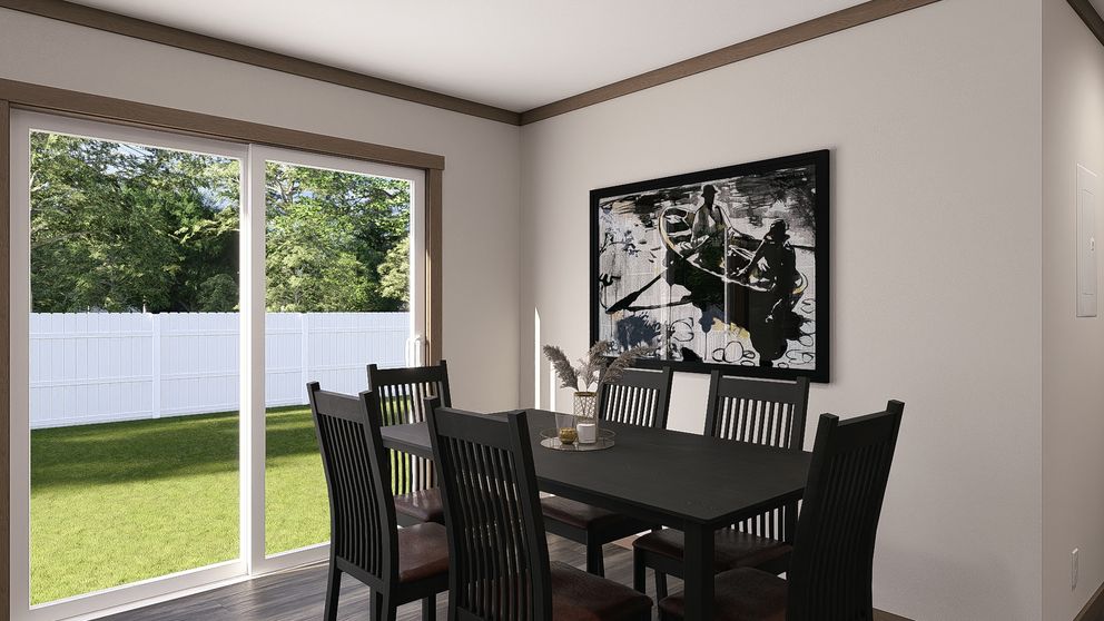 The EVERETT Dining Area. This Manufactured Mobile Home features 4 bedrooms and 3 baths.
