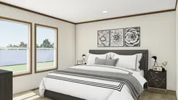 The THE IMPACT Primary Bedroom. This Manufactured Mobile Home features 4 bedrooms and 2 baths.